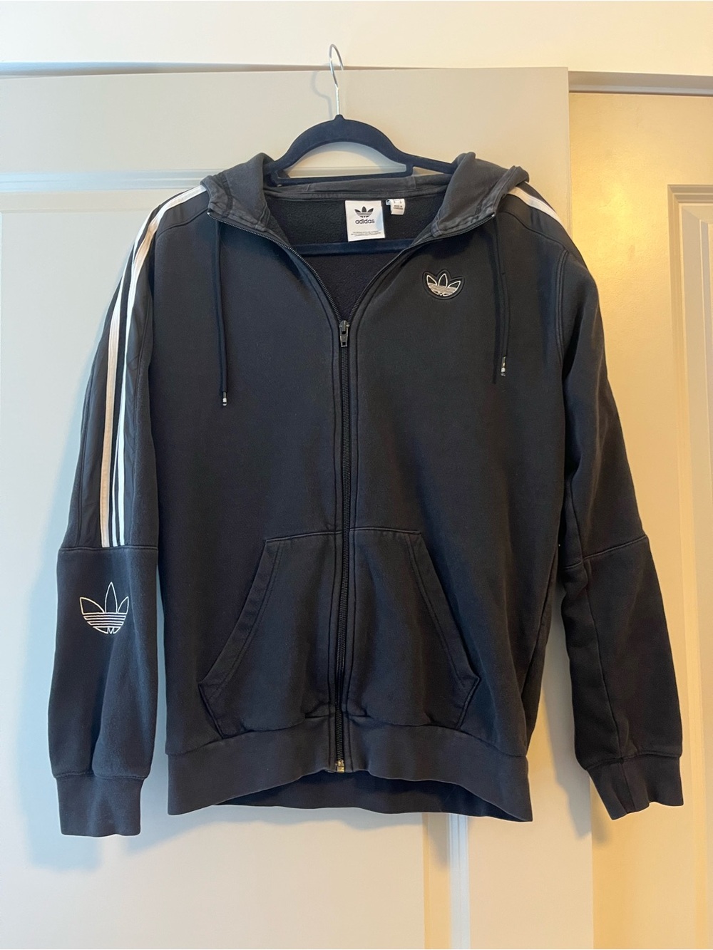 Men Adidas black zip up hoodie with white stripes on sleeves